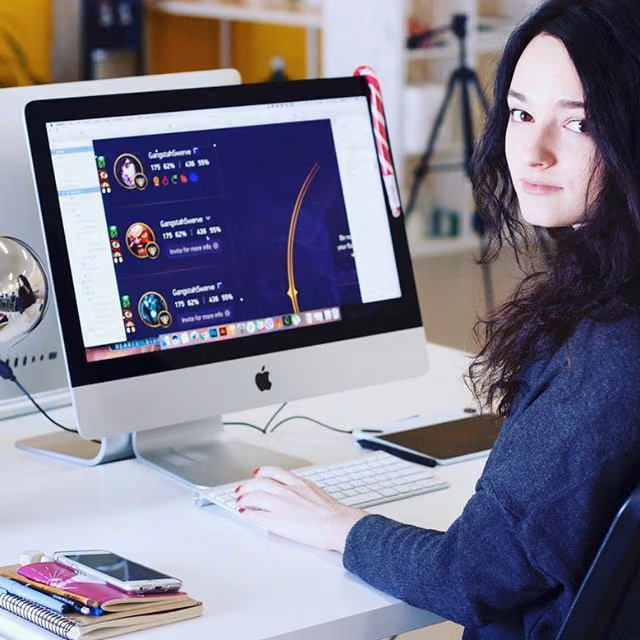 A Halo Lab designer beside her work on a studio screen