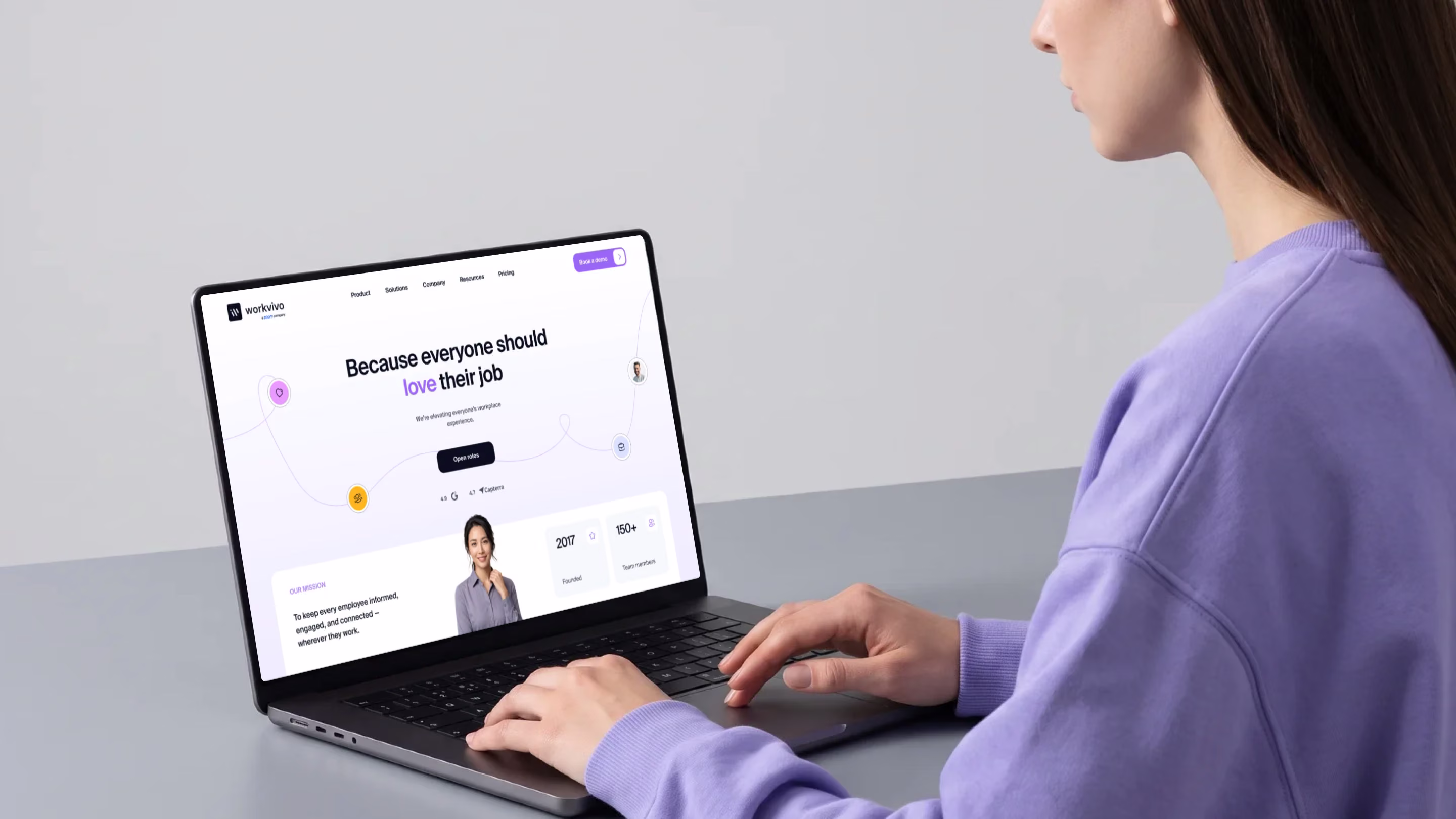 Redesigned WorkVivo homepage on a laptop with the Because everyone should love their job headline by Halo Lab
