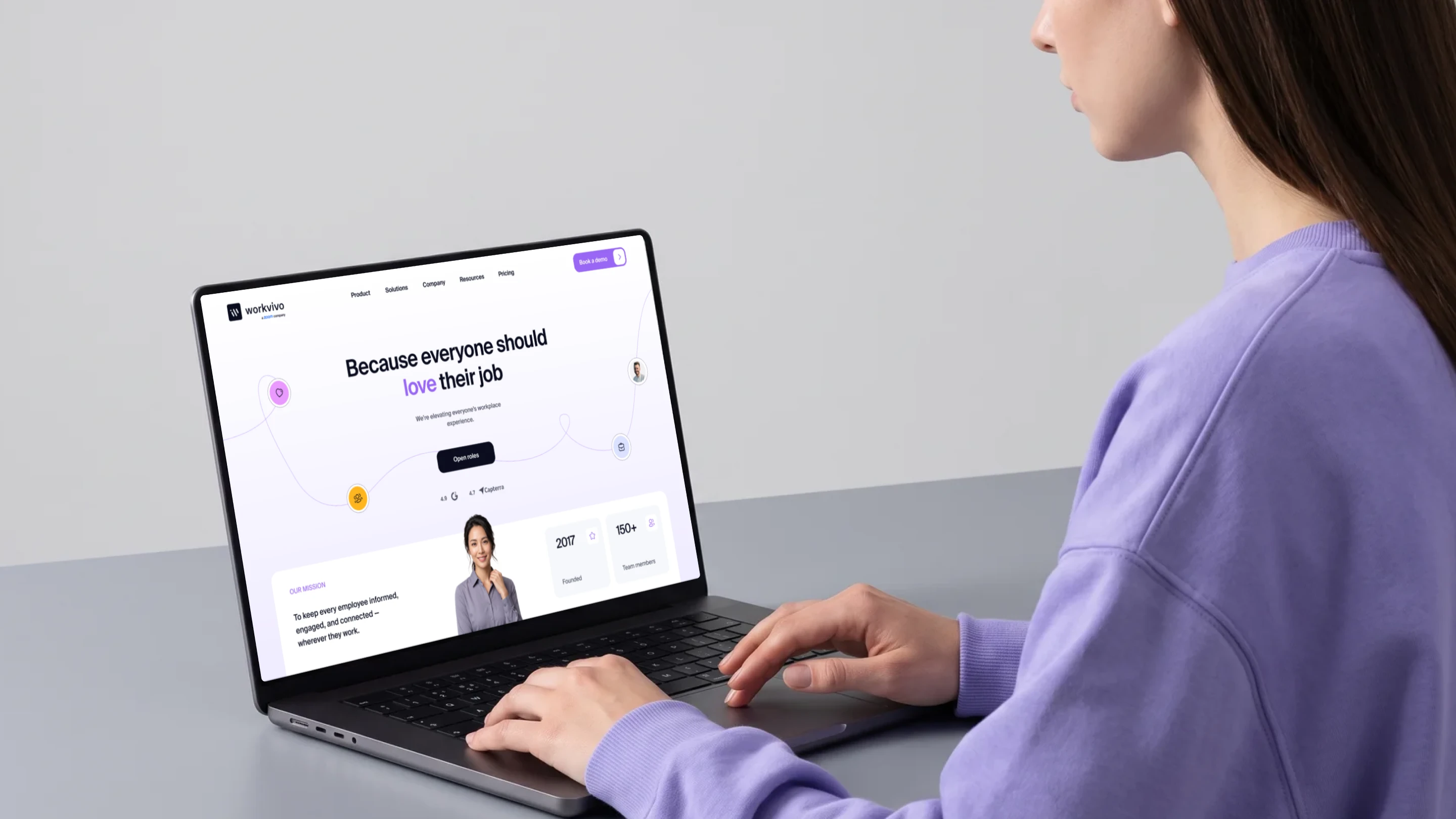 Redesigned WorkVivo homepage on a laptop with the Because everyone should love their job headline by Halo Lab