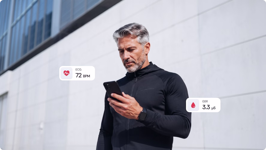 Man checking live ECG and GSR readings from the Rytmo app on his phone