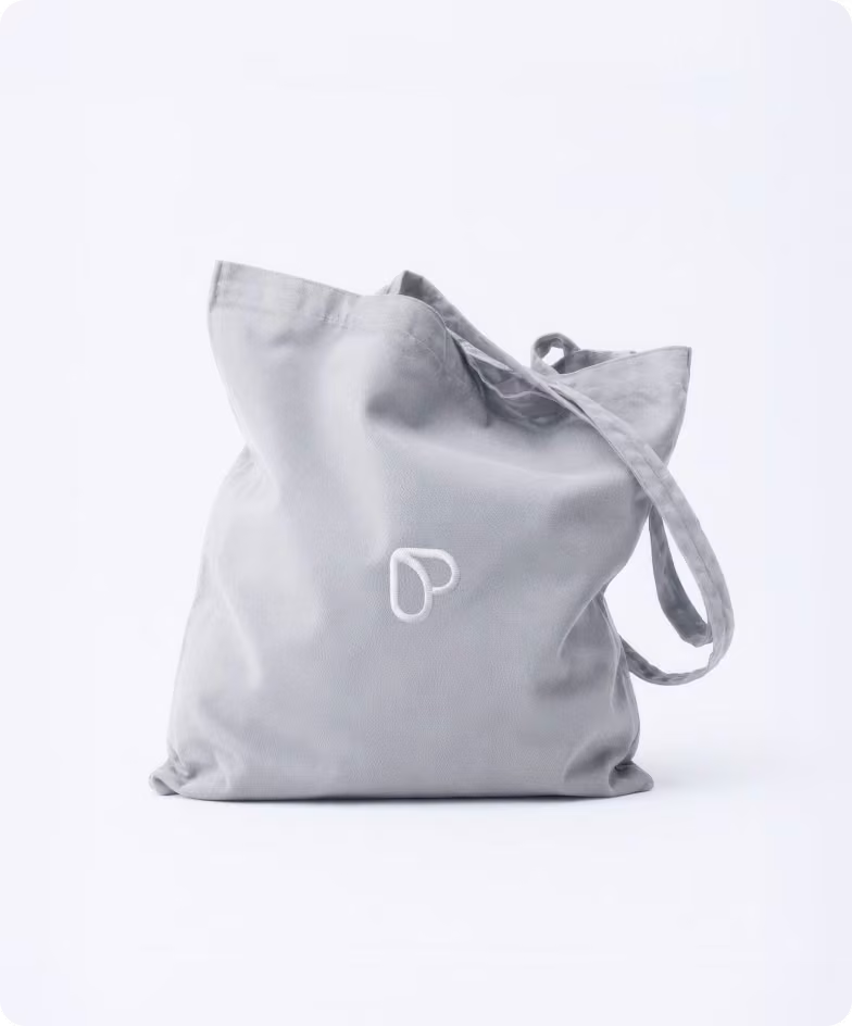 Branded Passion.io tote bag carrying the new logomark