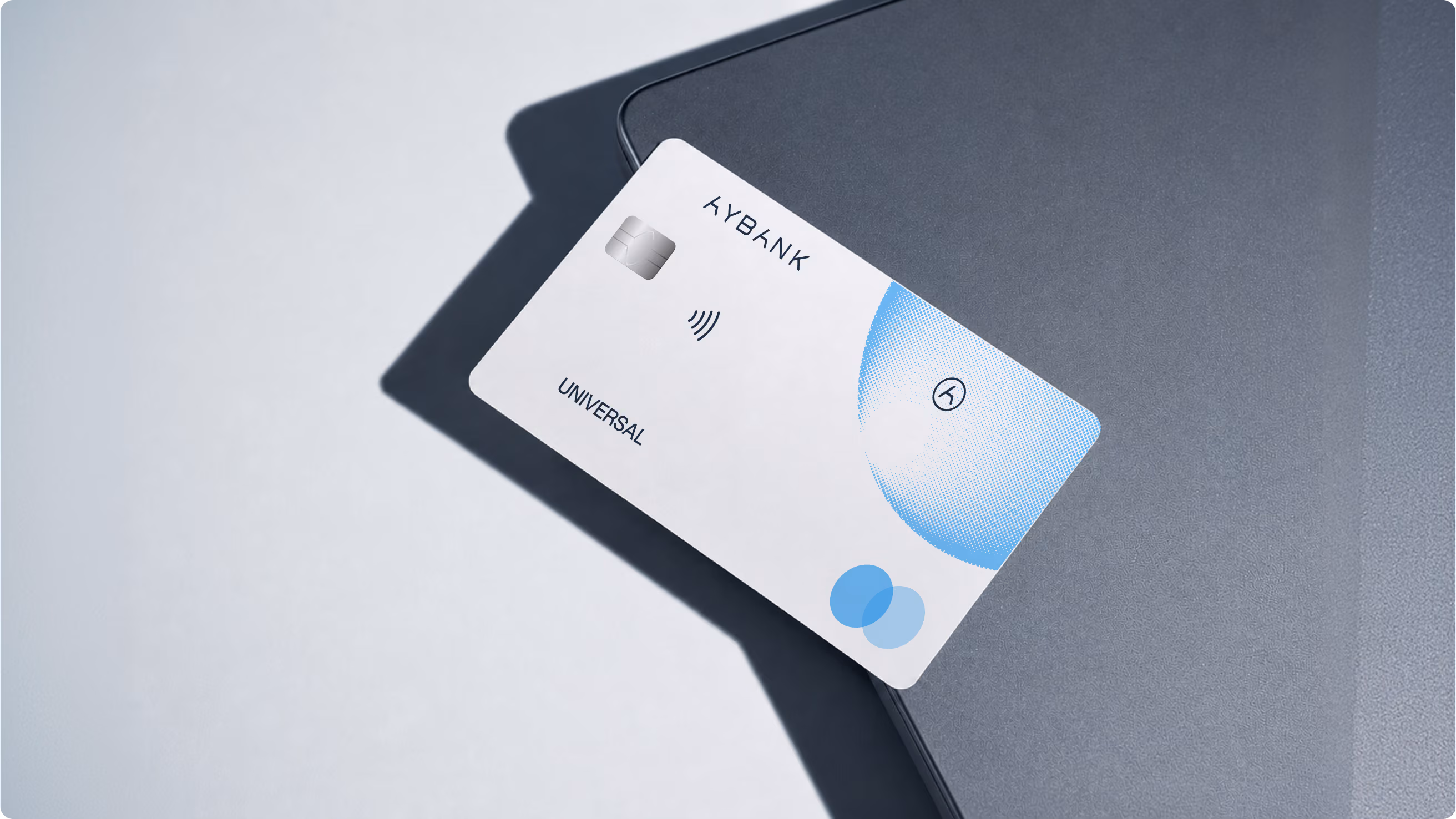 Aybank payment card design on a desk, part of the neobank brand identity by Halo Lab