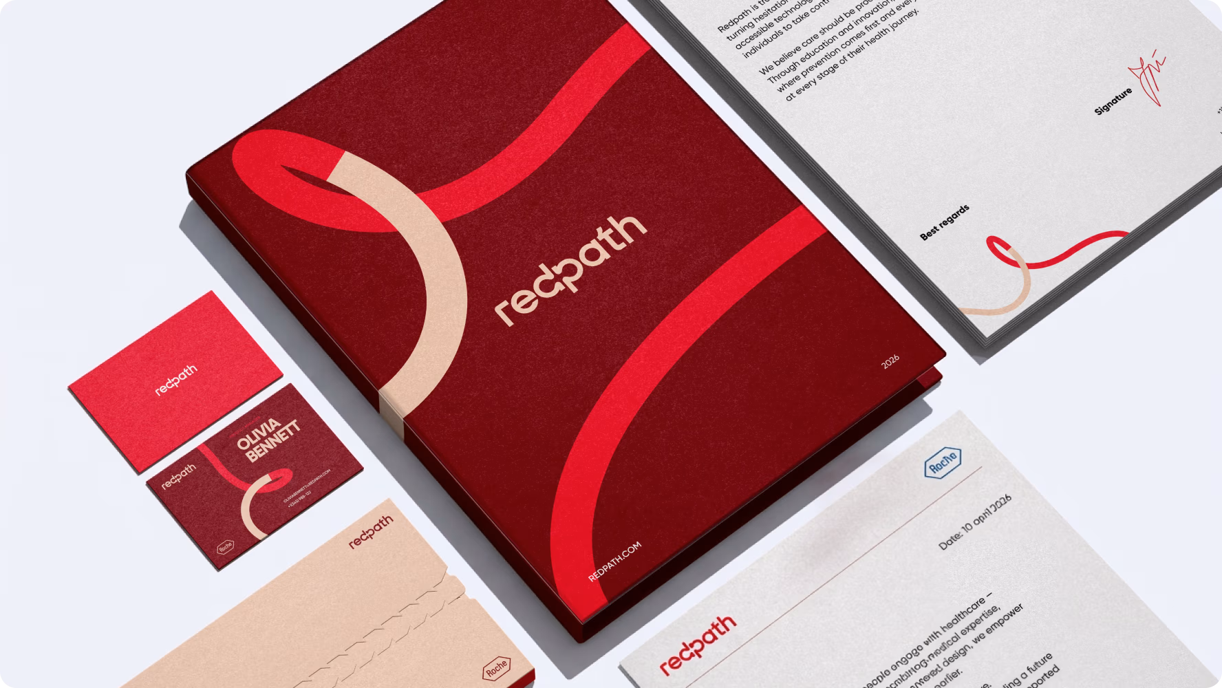 RedPath brand collateral including a folder, business cards and printed materials