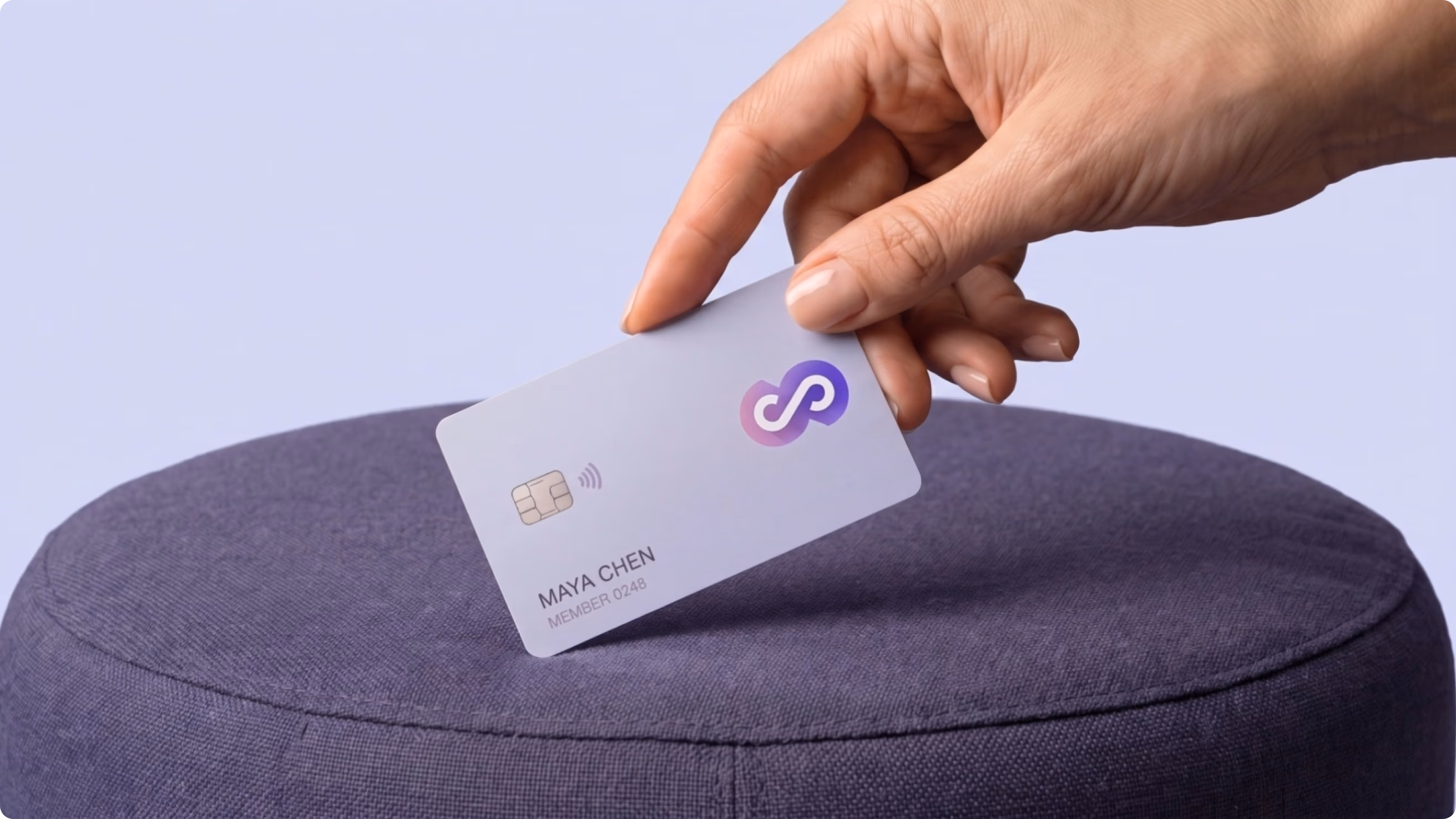 Hand holding a Chainstarters branded payment card